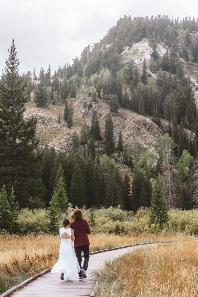 Couple walking at their wedding in Brighton Resort, in Utah