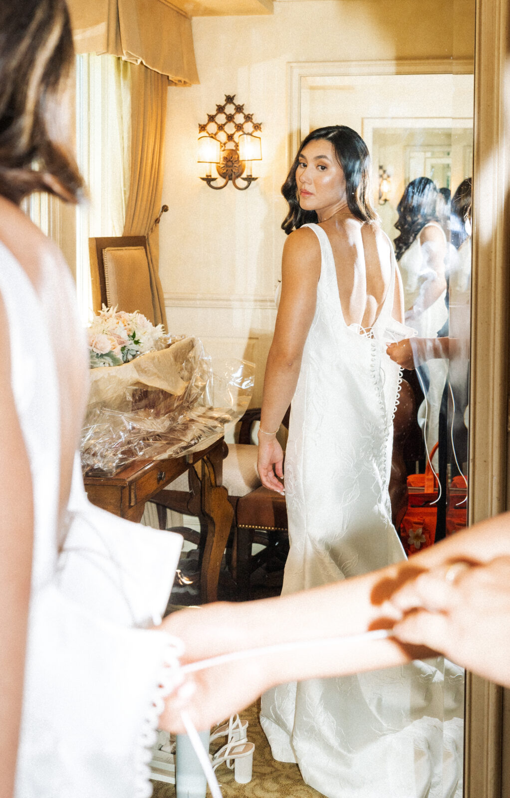 Orange County Wedding Photos of Brides wedding dress in mirror