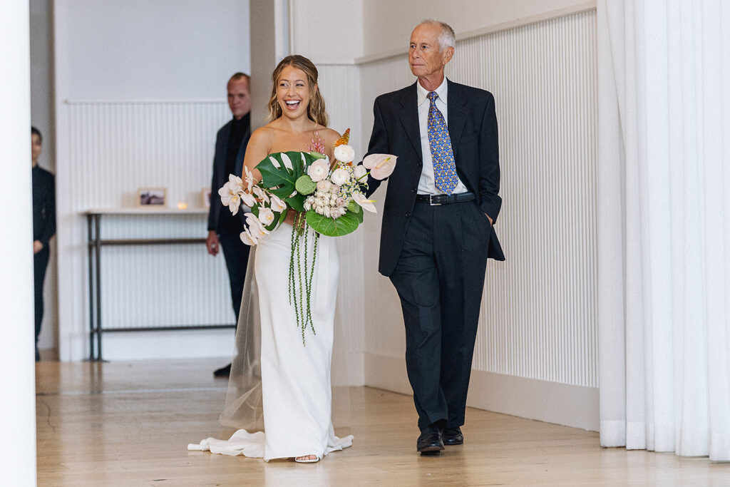 Bride walking down the isle with her dad at The Rockaway Hotel.