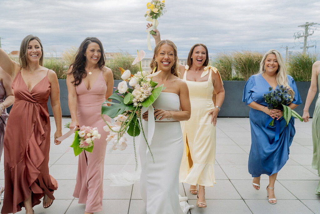 Bridesmaids celebrating at The Rockaway Hotel at Rockaway Beach in New York.