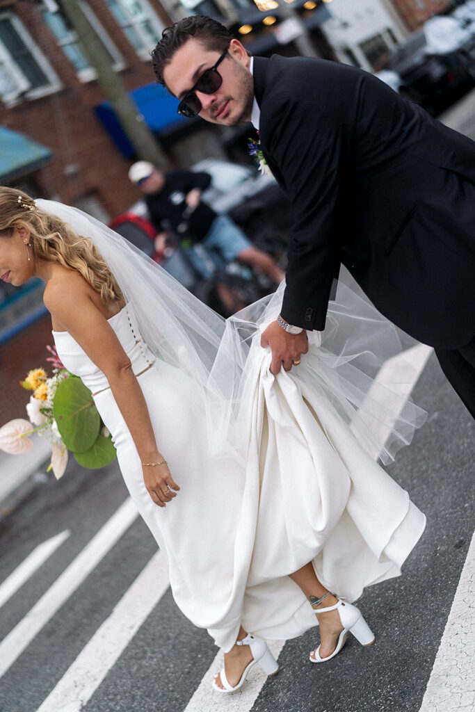 Bride and Groom photos on the streets of Rockaway Beach in New York.