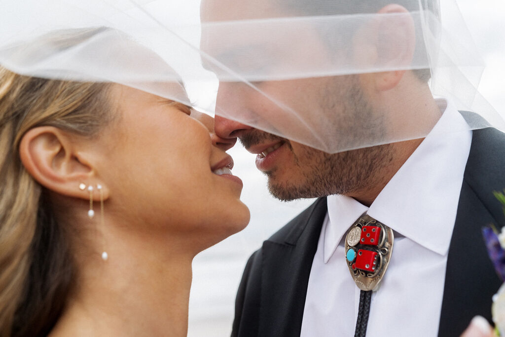 Bride and Groom photos on the streets of Rockaway Beach in New York.