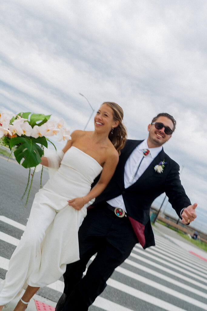 Bride and Groom photos on the streets of Rockaway Beach in New York.