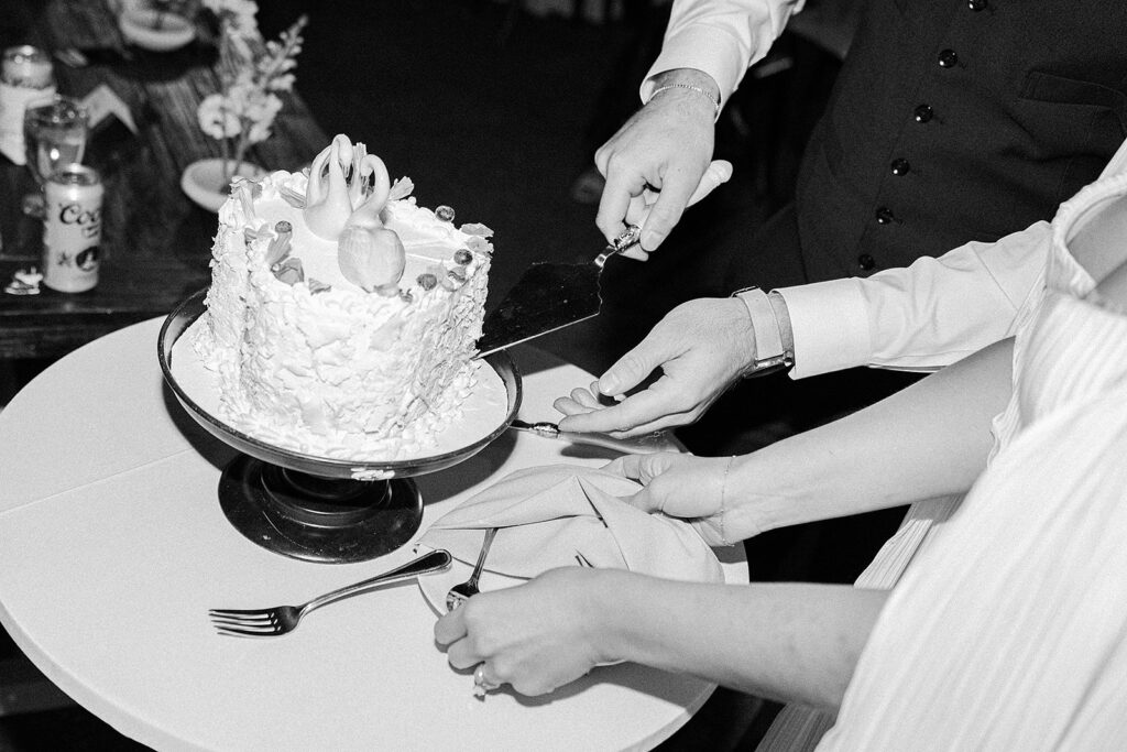 Bride and groom cutting their cake at Blanc Denver