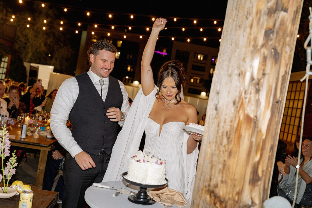 Bride and groom cutting their cake at Blanc Denver