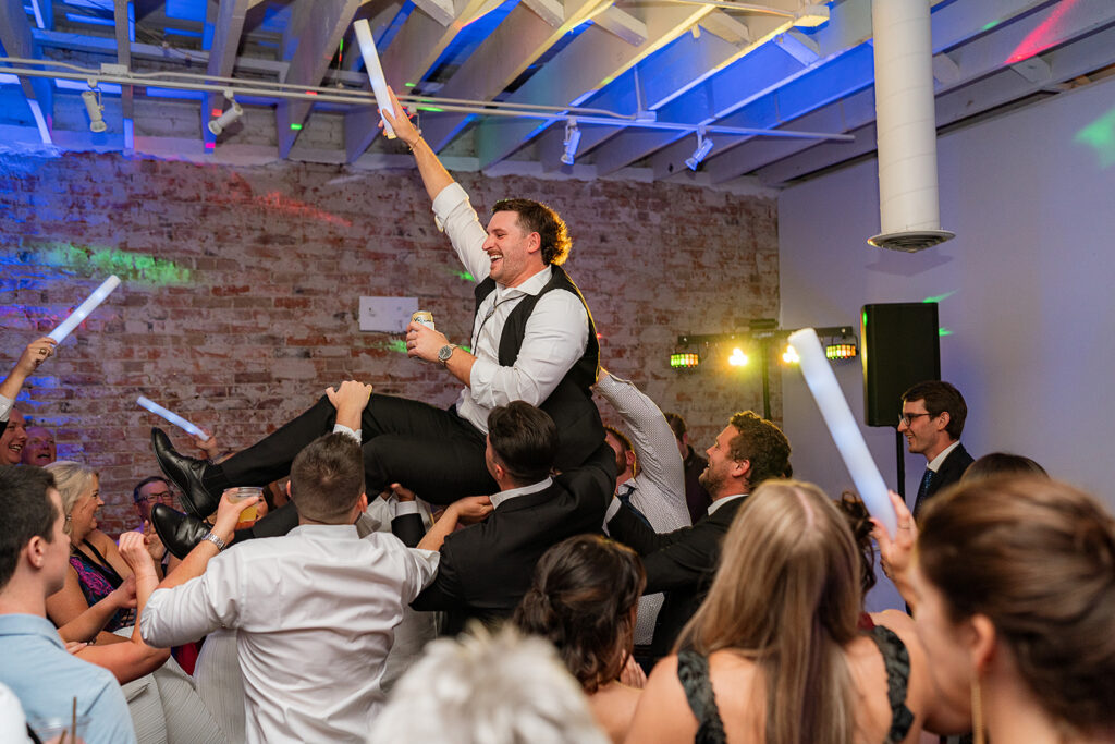 Candid dance floor moments from Trevor and Madison’s wedding reception at Blanc Denver