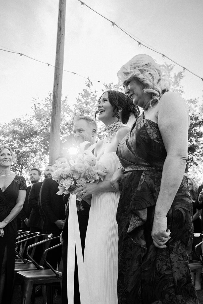 Brides parents walking the bride down the aisle