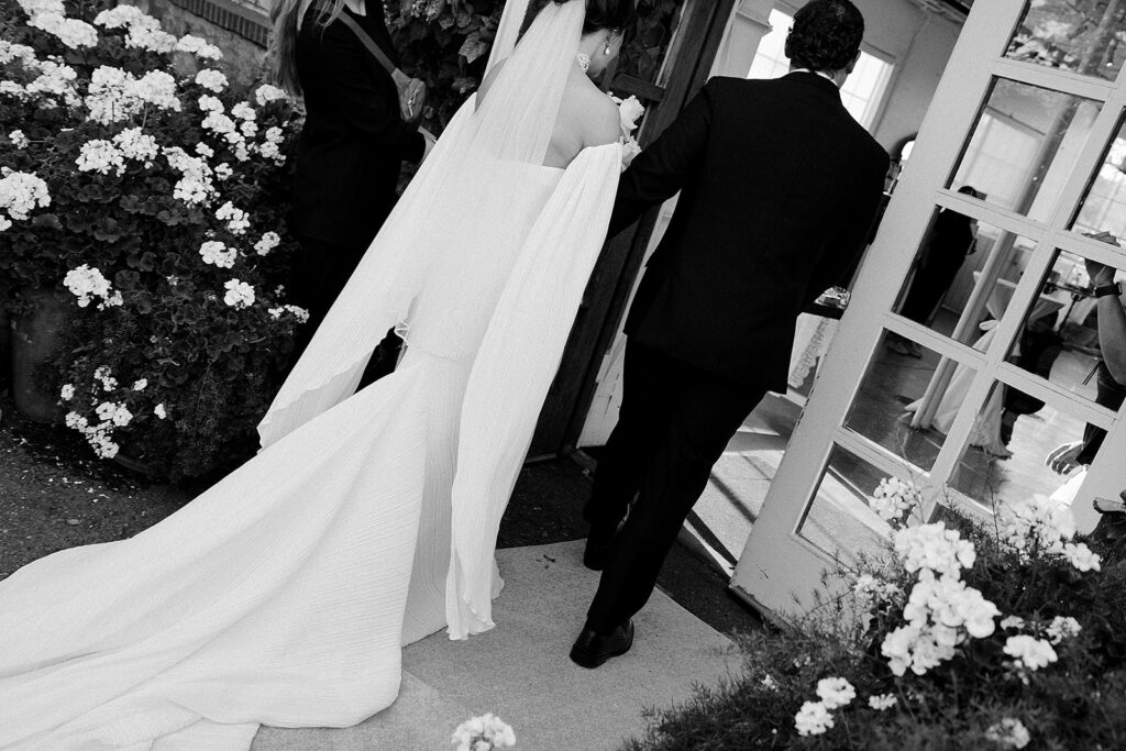 The bride and groom walking back down the aisle after getting married