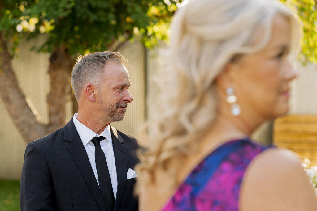 Brides parents about to walk the bride down the aisle